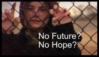 A young woman looks hopelessly through a high fence.